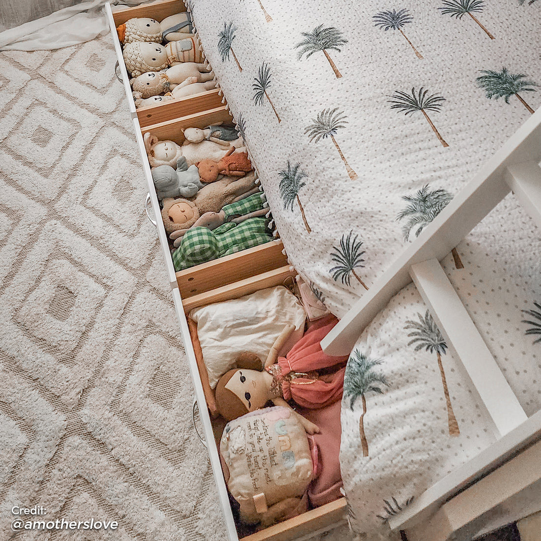 Cornelia Storage Triple Bunk Bed - White Solid Wood, featuring full-length guard rails, a solid wood ladder, and spacious under-bed drawers filled with stuffed animals for added storage and child-friendly design.