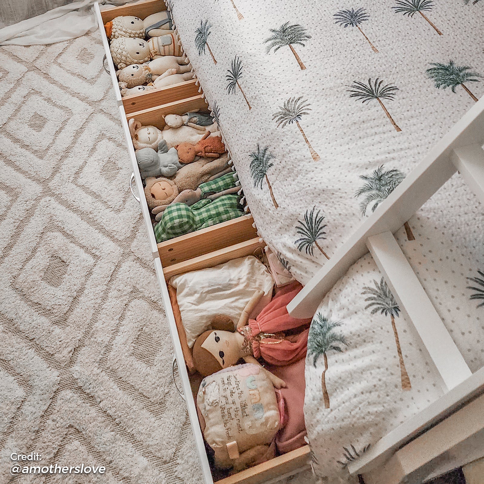 Cornelia Storage Triple Bunk Bed - White Solid Wood, featuring full-length guard rails, a solid wood ladder, and spacious under-bed drawers filled with stuffed animals for added storage and child-friendly design.