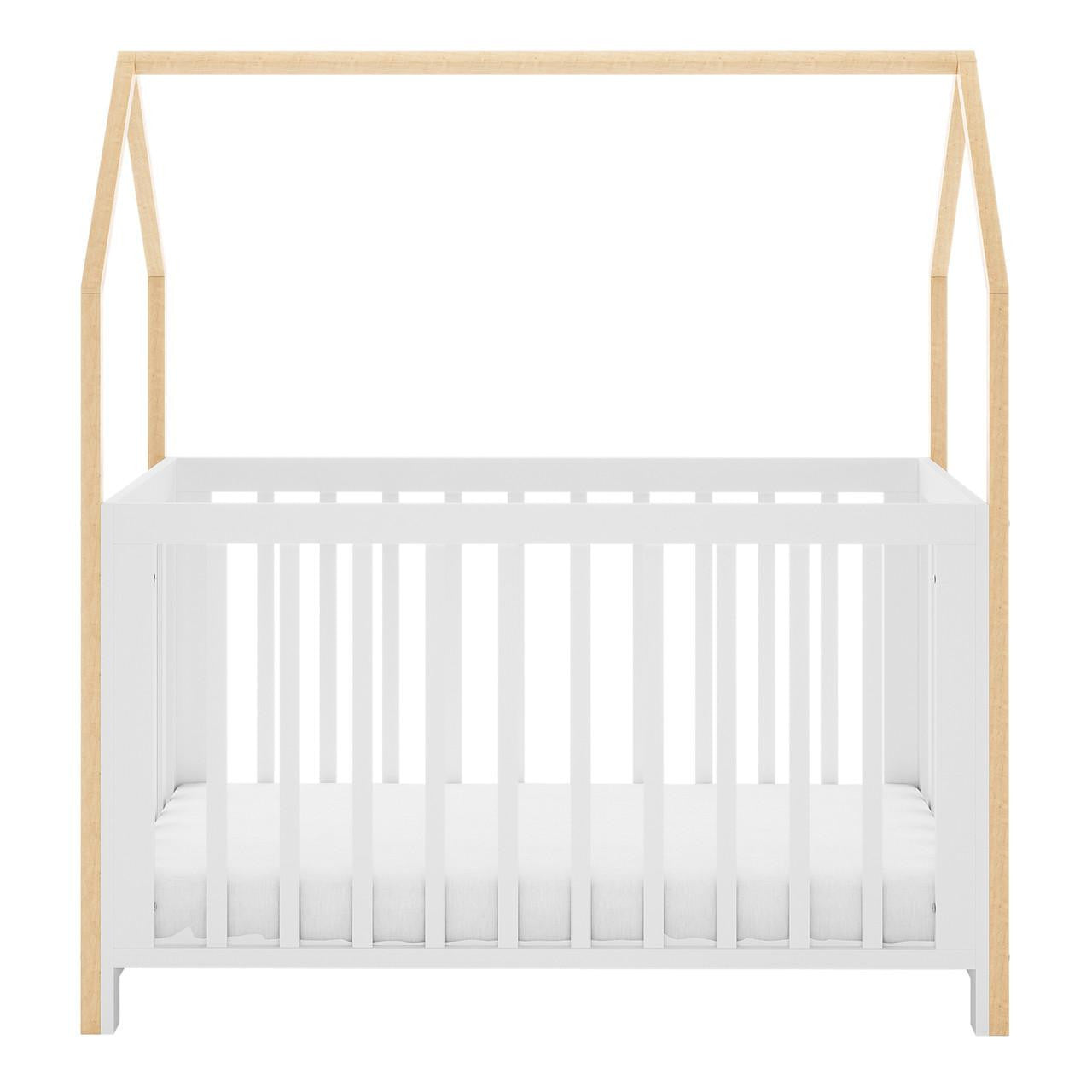 Damaris & Giro Solid Pine Baby Cot with Convertible Rail Set White features a white slatted base with natural wood posts, forming a house-shaped frame, highlighting its whimsical and adaptable nursery design.