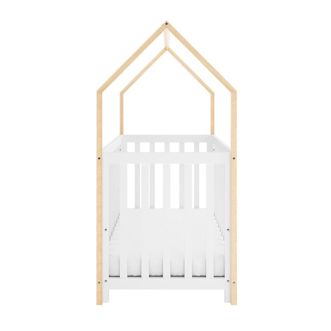 Damaris & Giro Solid Pine Baby Cot with Convertible Rail Set White features a house-shaped design, white crib frame, and natural-wood posts forming a pitched roof, ideal for nursery charm and adaptability.