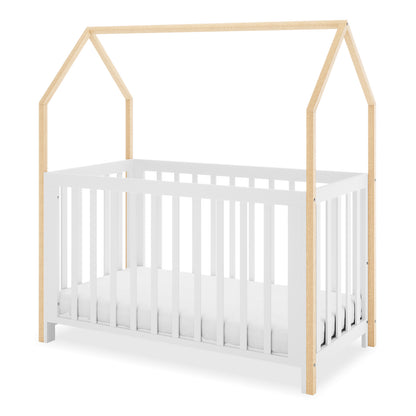 Damaris Adjustable Solid Wood Baby Cot in White & Natural, features a charming house-shaped frame with a white slatted base and natural wood posts forming a pitched roof design, perfect for imaginative nursery settings.