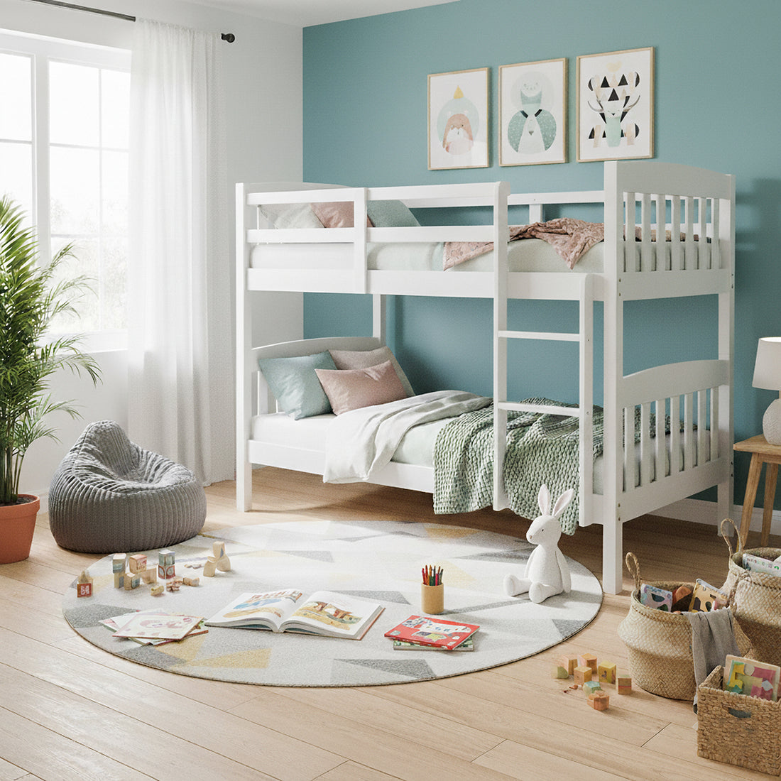 Dante 2-in-1 Solid Pine Timber Bunk Bed in White against a teal wall, adorned with pastel bedding and prints above, beside a window, rug, and toys, enhancing a cheerful children’s bedroom.