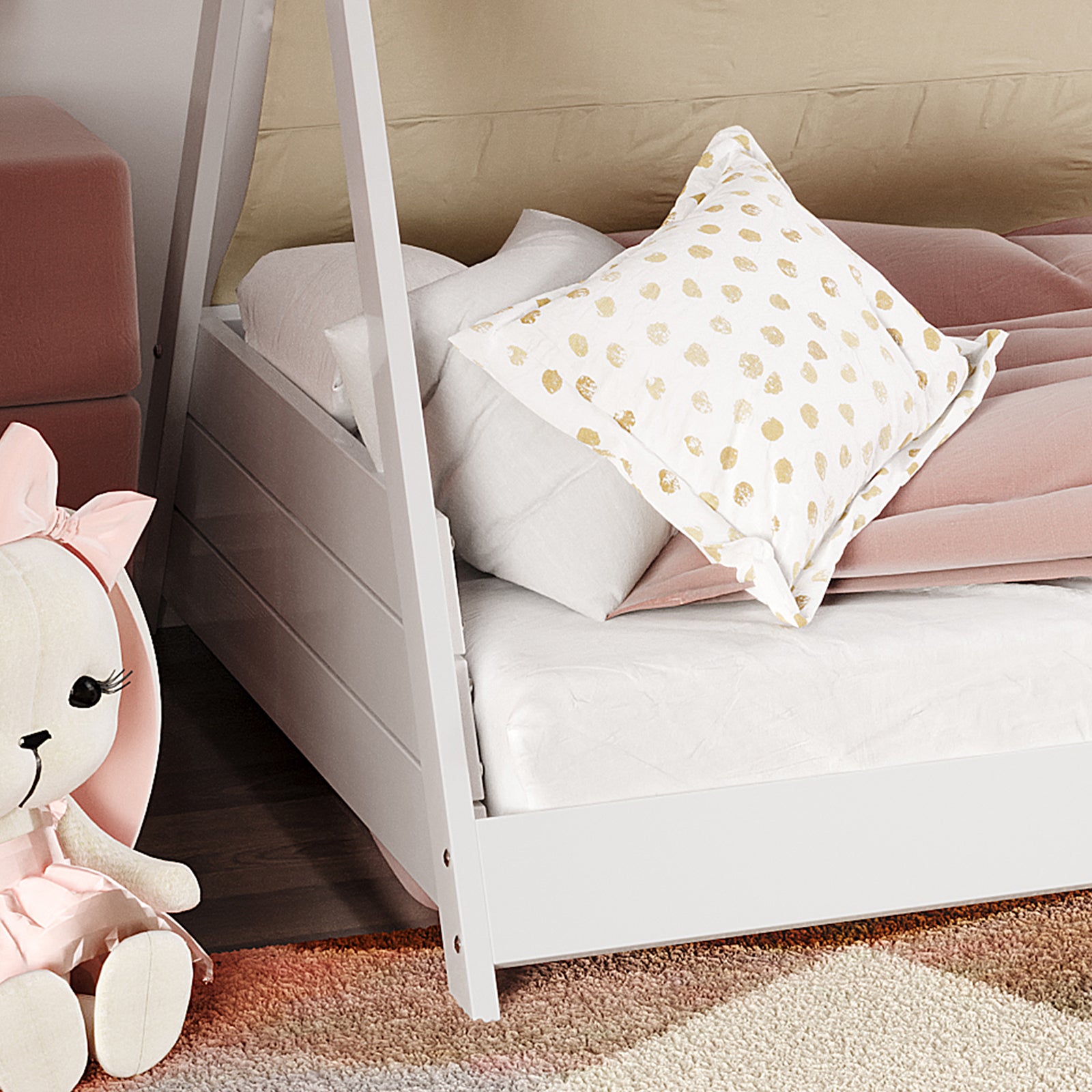 Elijah Kids Single Solid Wood Tee Pee Bed Frame in White features a house-frame design with white sheets, a pink velvet blanket, and a decorative pillow. A plush bunny and pink ottoman accompany it.