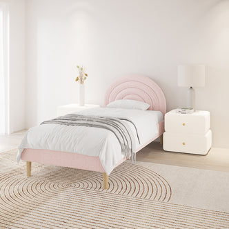 Estilla Single Rainbow Boucle Bed Frame in Ice Blue features a plush, semi-circular headboard, white bedding, and a light gray throw, positioned in a minimalist bedroom with coordinating furniture.