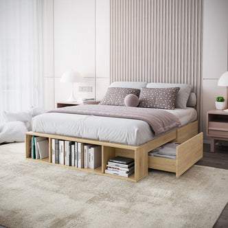 Eulalia Double Storage Platform Bed Base with Drawer in Oak features built-in storage with open cubby shelves and side drawers. It includes gray sheets, star-patterned pillows, and a mauve throw blanket.
