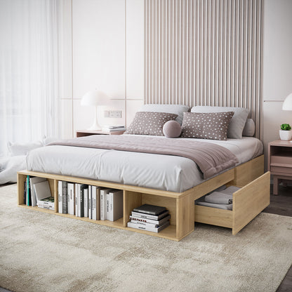 Eulalia Queen Storage Platform Bed Base with Drawer in Oak features a low-profile design with built-in footboard cubbies for books, and a side drawer filled with folded linens, complemented by a vertical slatted headboard.