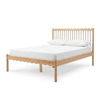 Minimalist wooden bed frame with mattress and two pillows on a white background