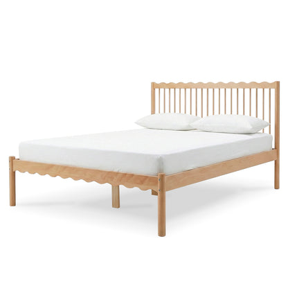 Light wood bed frame with white mattress and pillows on white background