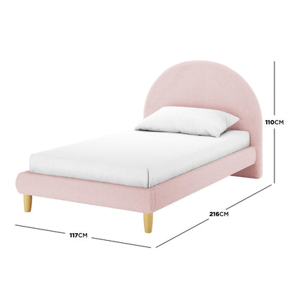 Fausta King Single Arched Bouclé Bed Frame in Light Pink, featuring a rounded upholstered headboard, white mattress, and pillow. It stands on tapered wooden legs, measuring 216 cm long and 117 cm wide.