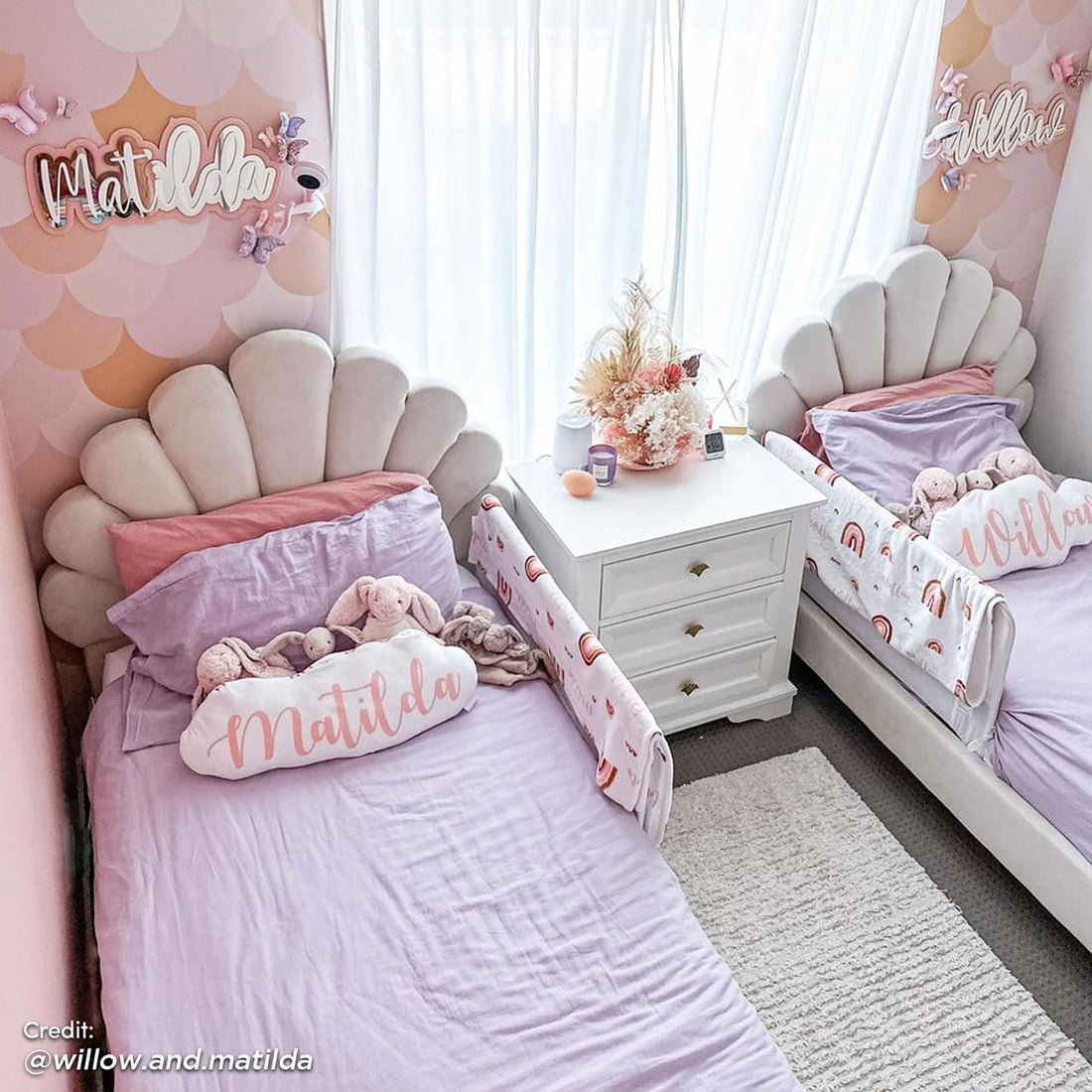 Fayette Kids Single Velvet Fabric Bed Frame in Cream White features a whimsical seashell headboard, plush velvet upholstery, and sturdy construction, enhancing a pastel-themed kids' bedroom with comfort and style.
