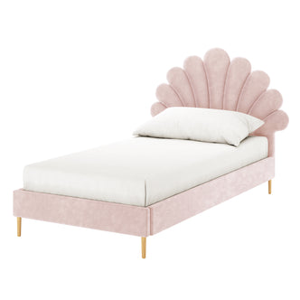 Fayette Kids Single Velvet Fabric Bed Frame in Soft Pink featuring a scallop-shaped headboard, blush-pink velvet upholstery, and slender wooden legs. The bed includes a white fitted sheet and pillow.