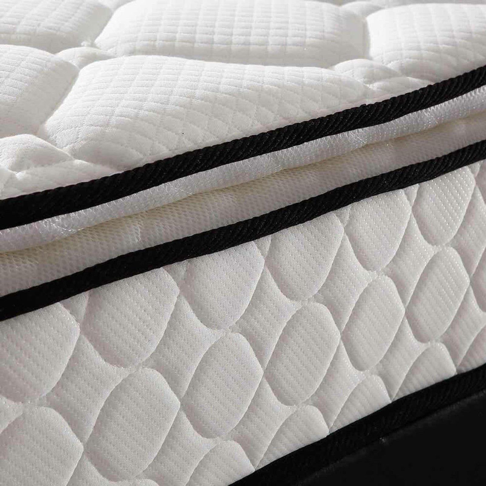 Close-up of the Venus Mattress from the Aristos & Venus Bunk Bed & Mattress Package, featuring a quilted white fabric cover with raised oval patterns and black binding trim.