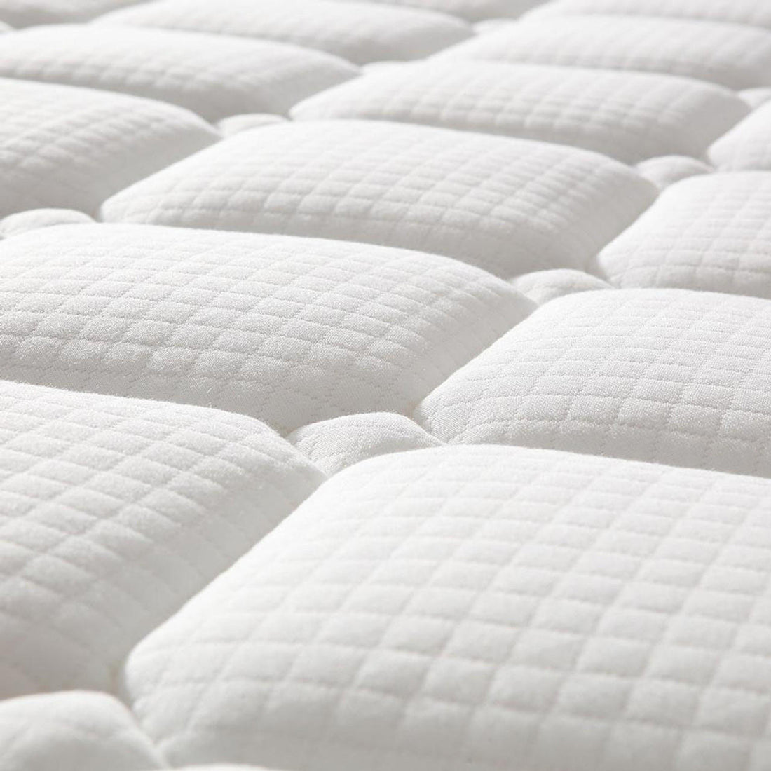 Close-up of the quilted mattress surface from the Aristos & Venus Bunk Bed & Mattress Package in White & Natural, showcasing its padded, tufted square pattern, highlighting comfort and quality.