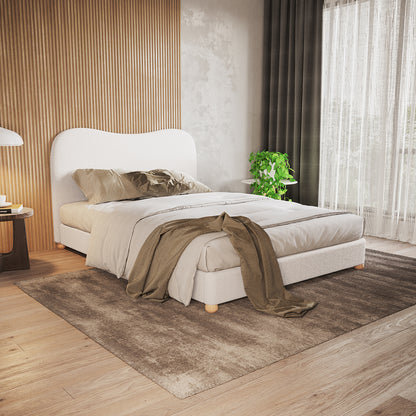 Ginnie Bouclé Curved Double Bed Frame in cream white, featuring a plush curved headboard, upholstered in bouclé fabric, centered in a softly lit bedroom with neutral bedding and a wooden nightstand.