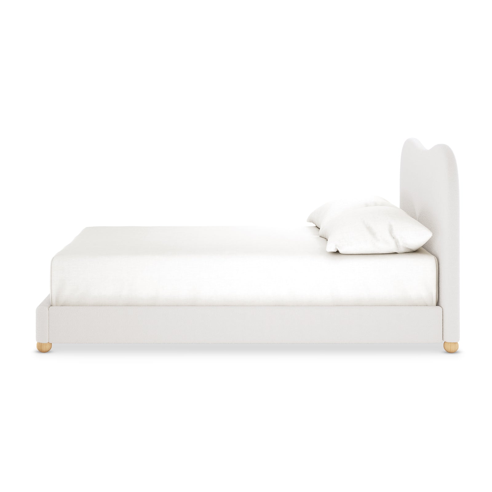 Ginnie Bouclé Curved Double Bed Frame in cream white, featuring a plush, gently curved headboard, white upholstery, and small round wooden feet, viewed from the side with pillows atop the mattress.