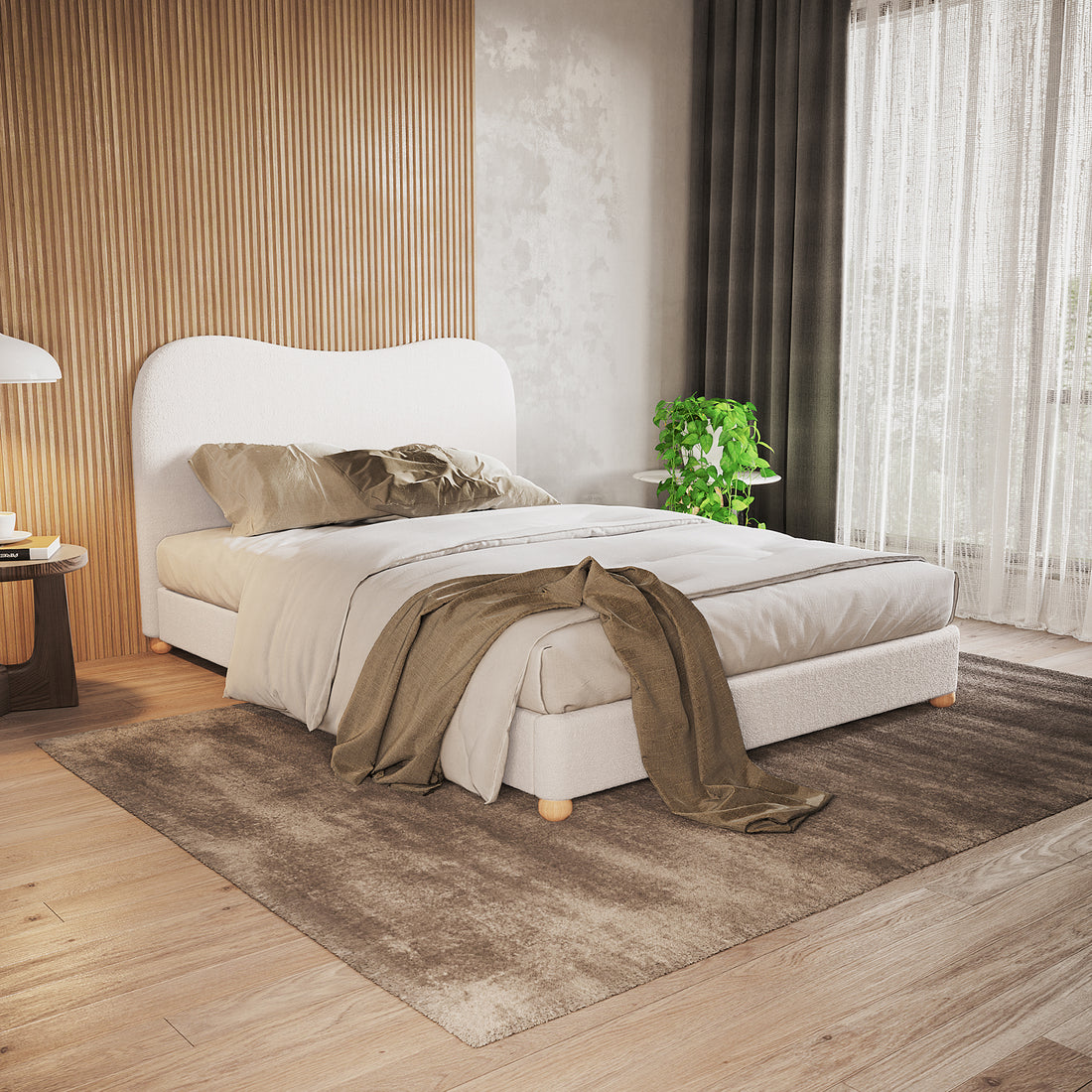 Ginnie Boucle Bed & Oriona Mattress - Double Cream, showcasing a plush curved headboard and sleek design, with a person relaxing on it, highlighting the bed's comfort and modern aesthetic.