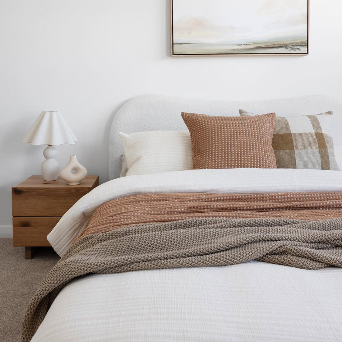 Ginnie Queen Curved Bouclé Cloud Bed Frame in Cream White, featuring a plush curved headboard upholstered in soft bouclé fabric, set in a minimalist bedroom with complementary bedding and decor.