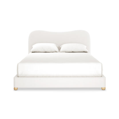 Ginnie Bouclé Curved Queen Bed Frame - Cream White features an off-white upholstered platform with a curved headboard, white bedding, two pillows, and short wooden legs, exuding modern elegance and comfort.