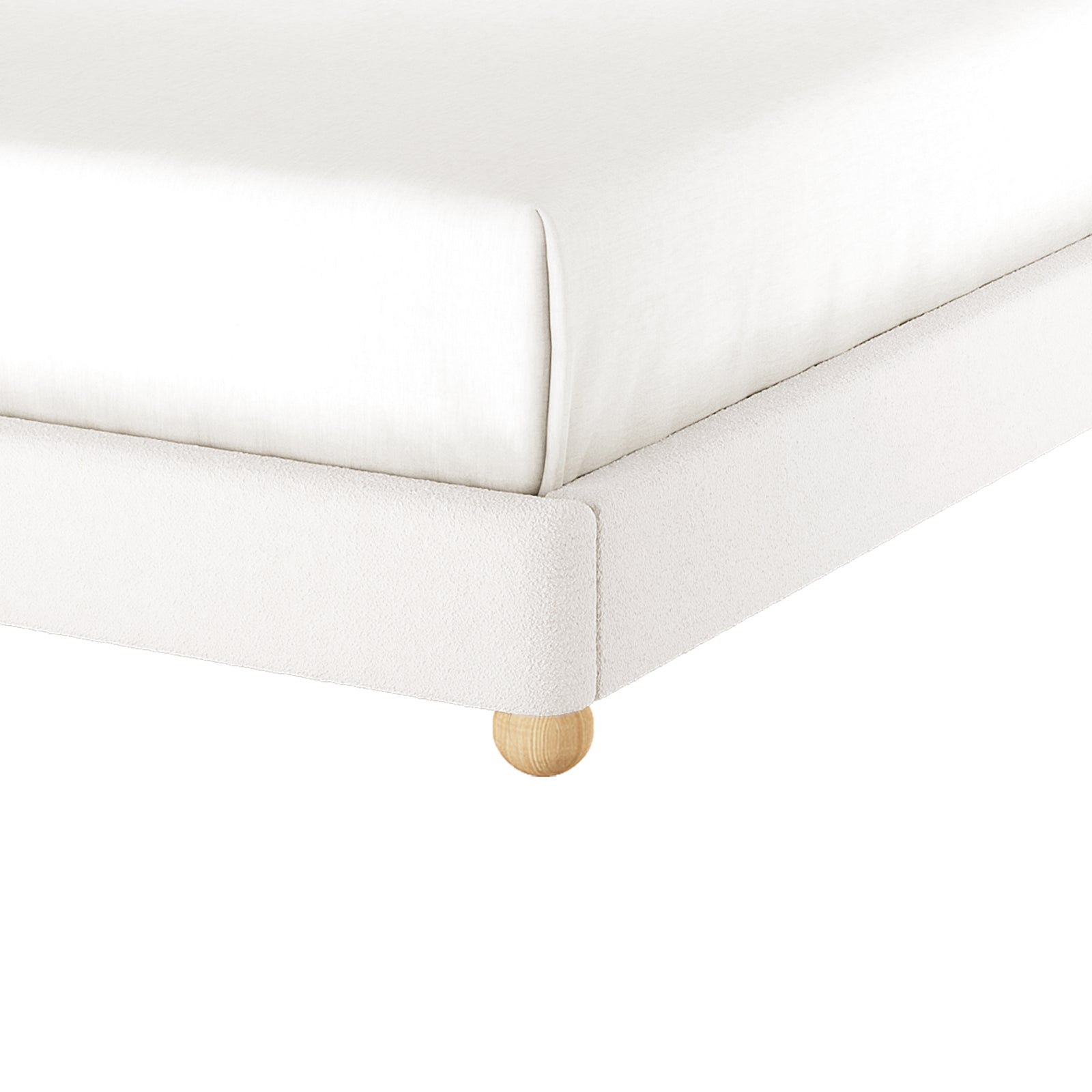 Close-up of the Ginnie Bouclé Curved Queen Bed Frame - Cream White, showcasing the white bouclé fabric platform, natural wood peg leg, and mattress atop, highlighting its elegant and modern design.