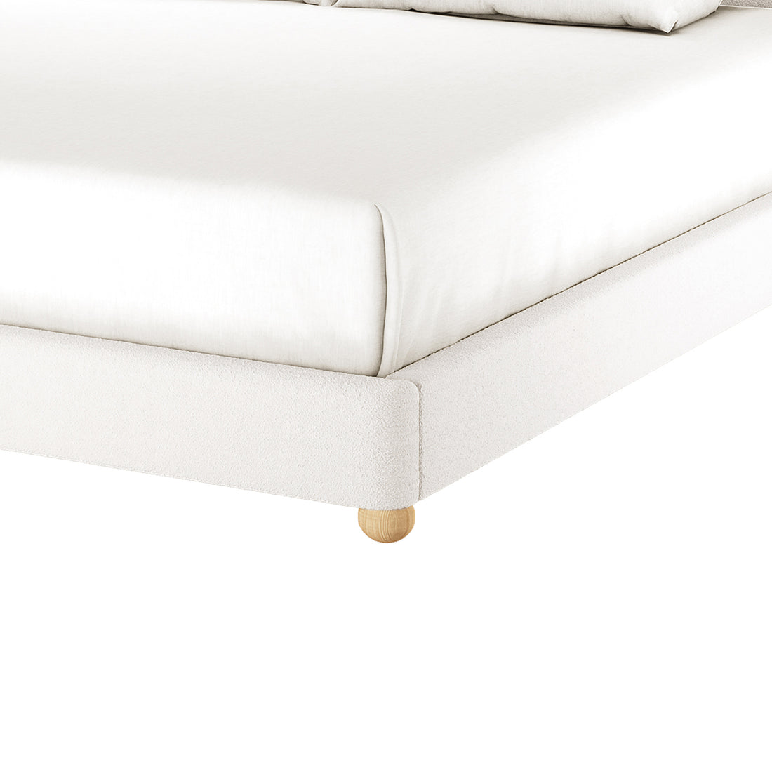 Ginnie Curved Bouclé Bed Frame - Cream White Super King shown with white-upholstered frame on wooden bun leg, fitted sheet, and visible pillows, highlighting its modern, comfortable design against a white backdrop.