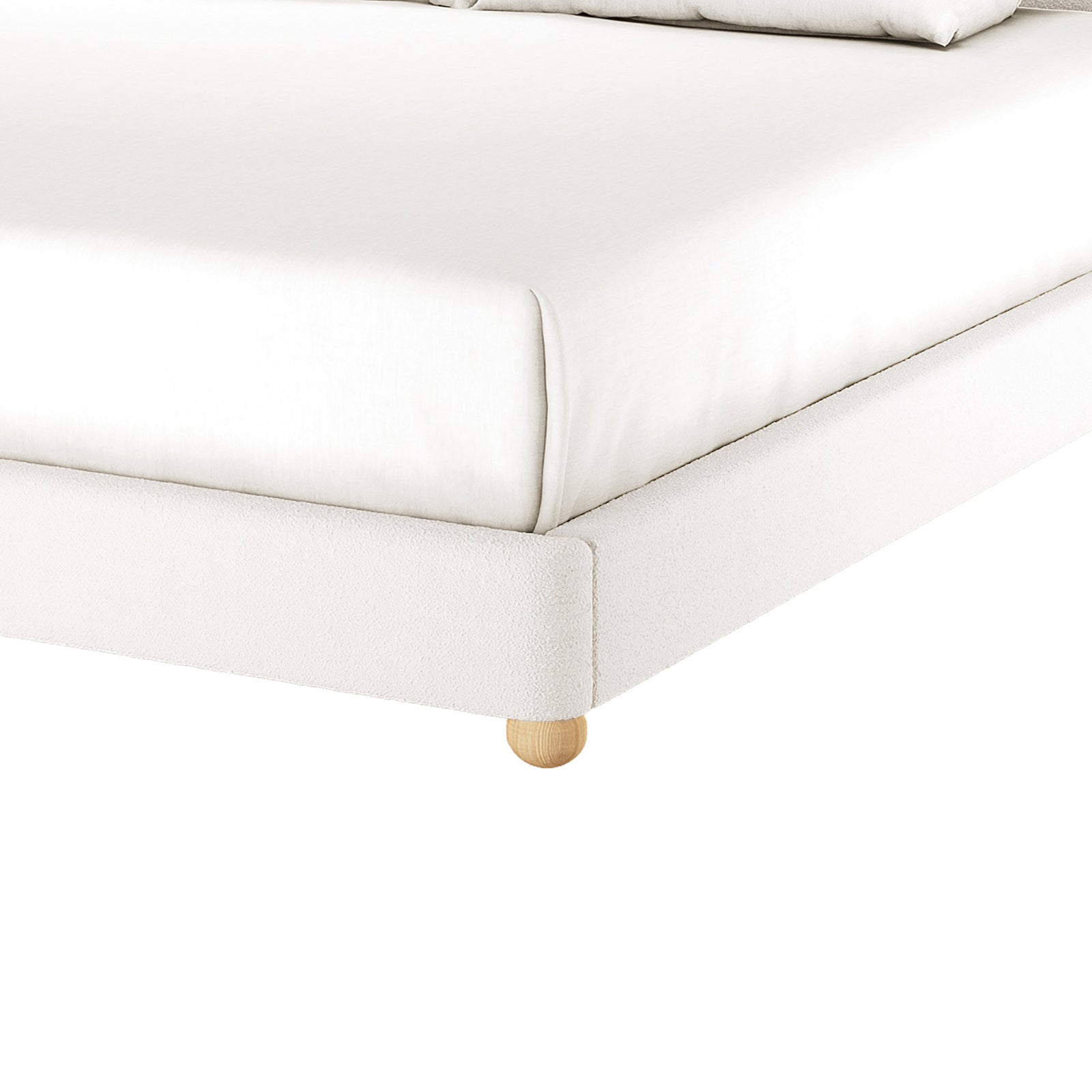 Ginnie Curved Bouclé Bed Frame - Cream White Super King shown with white-upholstered frame on wooden bun leg, fitted sheet, and visible pillows, highlighting its modern, comfortable design against a white backdrop.