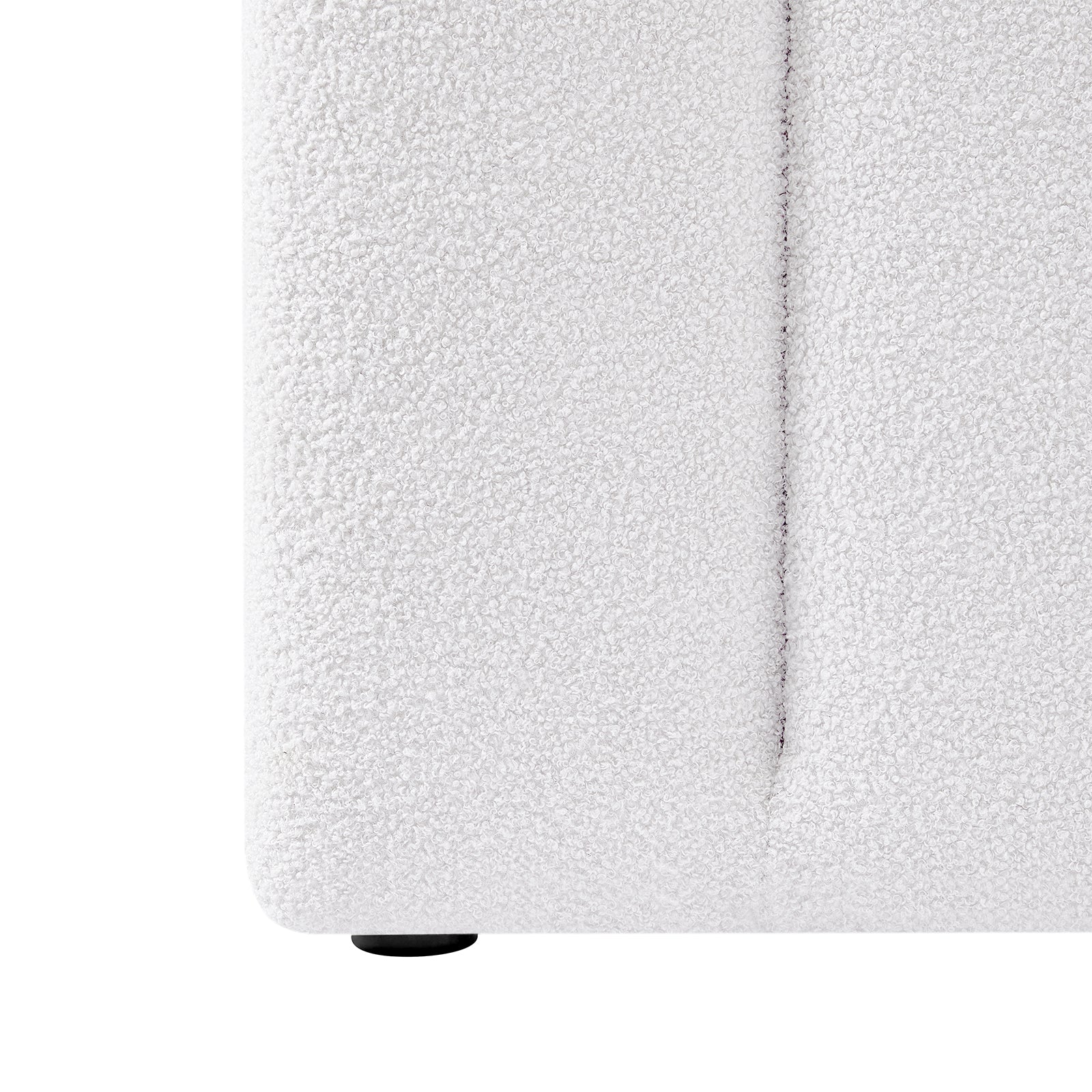 Close-up of the Aquila & Fabia Bed Package - Cream White King, showcasing the boucle-textured upholstery on the lower corner and a small round black foot, emphasizing luxury and style.