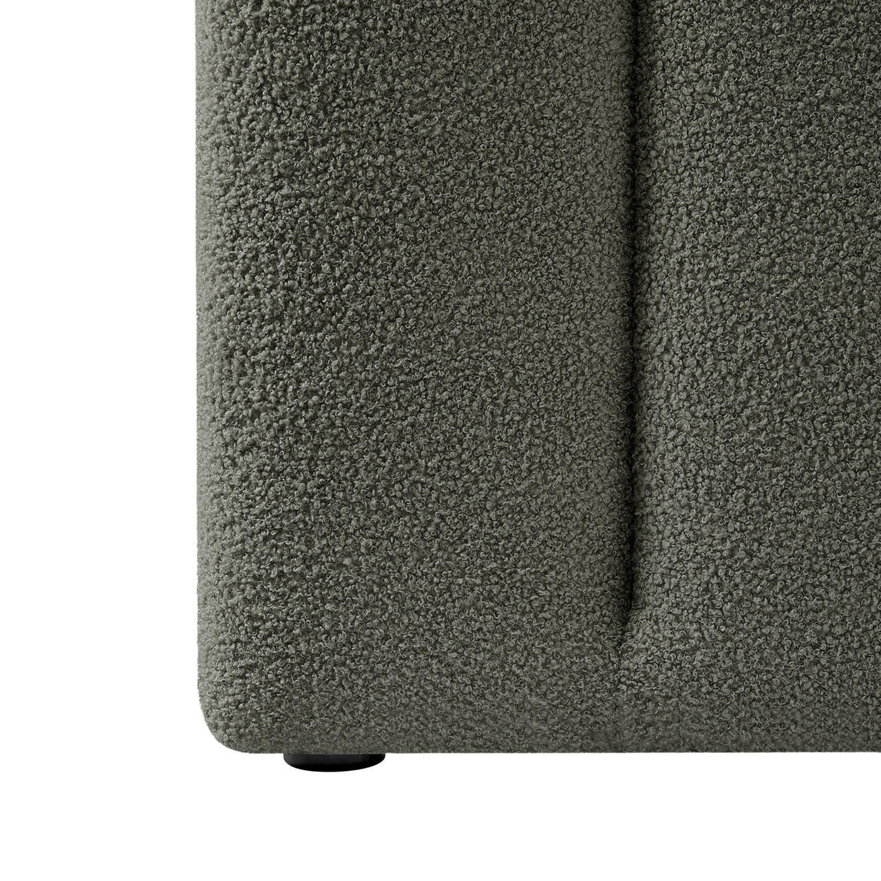 Close-up of the Aquila King Extra Wide Bouclé Headboard in Green, showcasing its tightly-looped bouclé fabric and a low-profile plastic foot, emphasizing its elegant texture and sturdy design.