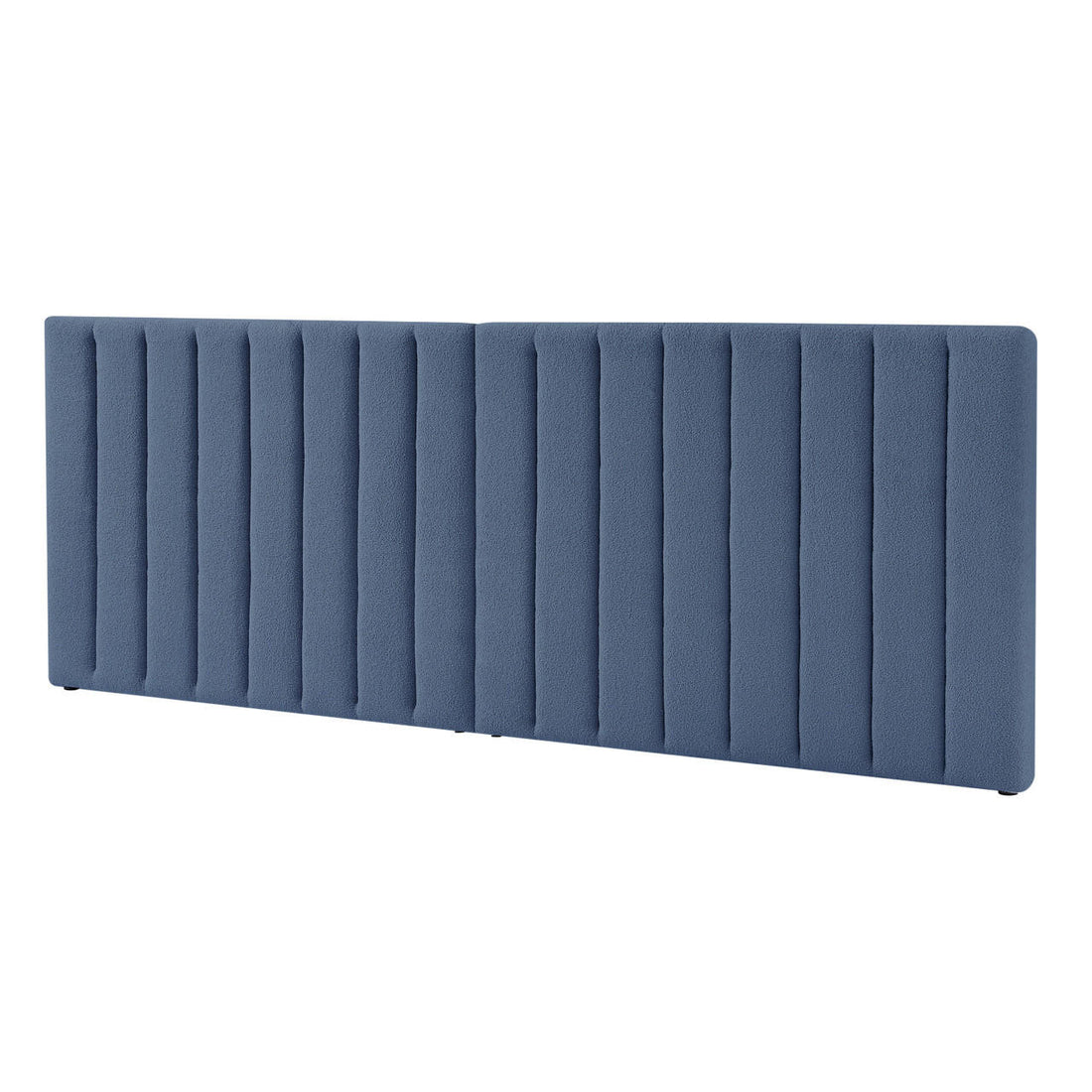 Aquila King Extra Wide Bouclé Headboard in Midnight Blue features a large, vertically channel-tufted design with padded upholstery, offering a luxurious and comfortable centerpiece for a bedroom.