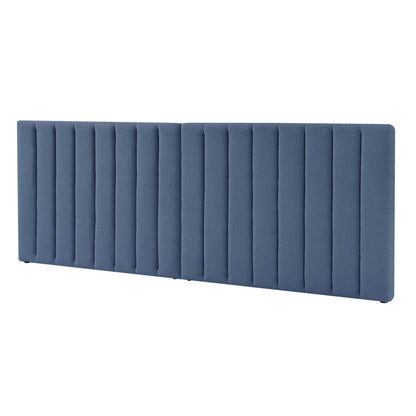 Aquila King Extra Wide Bouclé Headboard in Midnight Blue features a large, vertically channel-tufted design with padded upholstery, offering a luxurious and comfortable centerpiece for a bedroom.