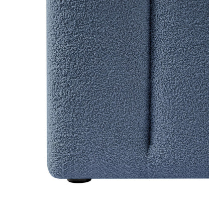 Close-up of Aquila Extra Wide King Bouclé Headboard in Midnight Blue, showcasing the textured bouclé fabric, vertical seam, and protective round glide at the base, highlighting luxurious design and craftsmanship.