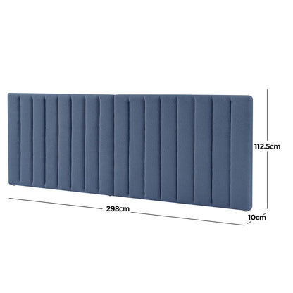Aquila King Extra Wide Bouclé Headboard in Midnight Blue, featuring vertical channel stitching on plush blue fabric, measures 298 cm wide, 112.5 cm tall, and 10 cm thick, creating an elegant bedroom focal point.