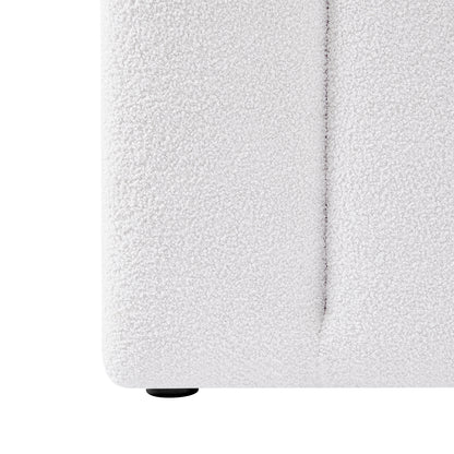 Close-up of the Aquila & Fabia Bed Package - Cream White Queen, showcasing the white bouclé fabric upholstery with a visible vertical seam and one small, round black foot at the bottom.