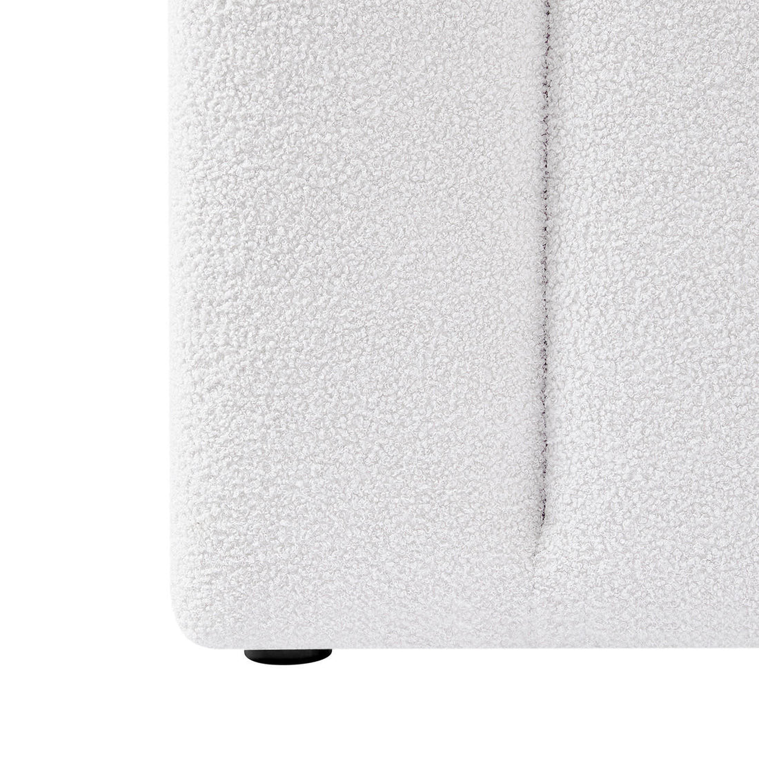 Close-up of the Aquila Queen Extra Wide Bouclé Headboard in Cream White, highlighting the looped bouclé fabric texture, a vertical seam, and one small round plastic foot.