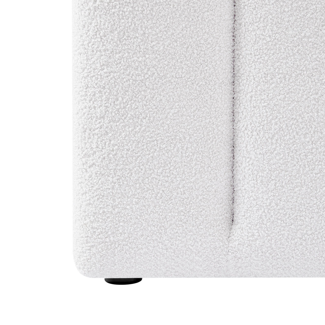 Close-up of the Aquila Queen Extra Wide Bouclé Headboard in Cream White, highlighting the looped bouclé fabric texture, a vertical seam, and one small round plastic foot.