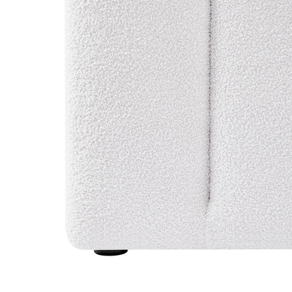 Close-up of the Aquila Queen Extra Wide Bouclé Headboard in Cream White, highlighting the looped bouclé fabric texture, a vertical seam, and one small round plastic foot.