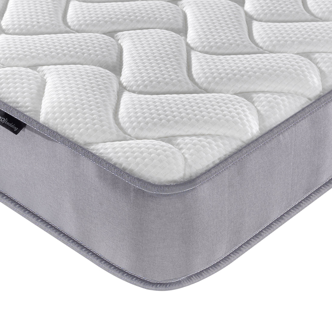 Close-up of the Harel & Vesta Slide Bunk Bed & Vesta Mattress Set in Natural, highlighting the quilted Vesta mattress corner with padded white surface and grey side panel for optimal comfort.