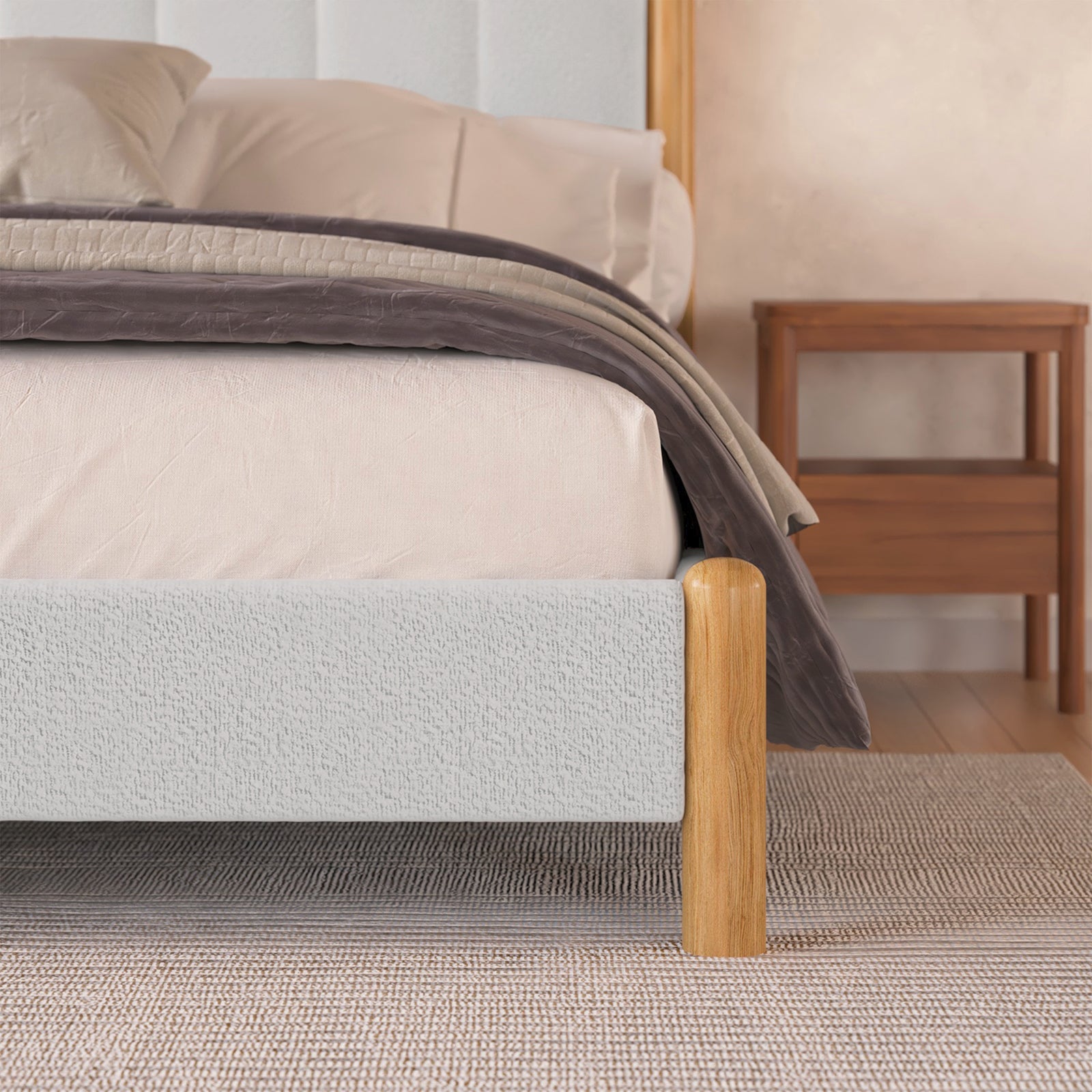 Close-up of Harper Boucle Double Bed Frame in Eggshell White, featuring boucle upholstery and natural timber accents, highlighting its modern, minimalist design and sturdy build with visible eucalyptus hardwood and rubber wood legs.