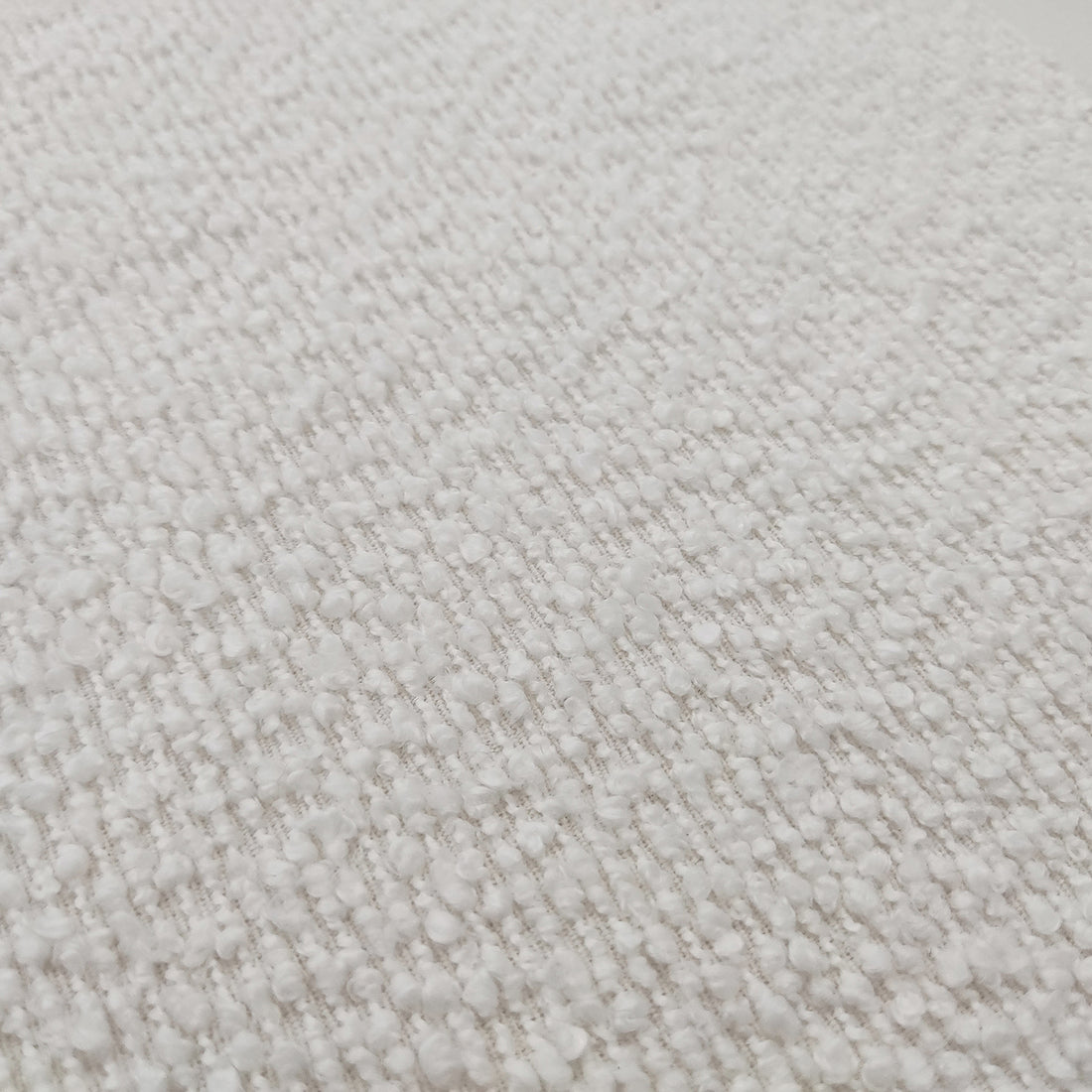 Harper Boucle Queen Bed Frame – Eggshell White showcasing its plush boucle upholstery and sturdy eucalyptus hardwood frame, highlighting the padded headboard and elegant wood accents on the frame's sides and legs.