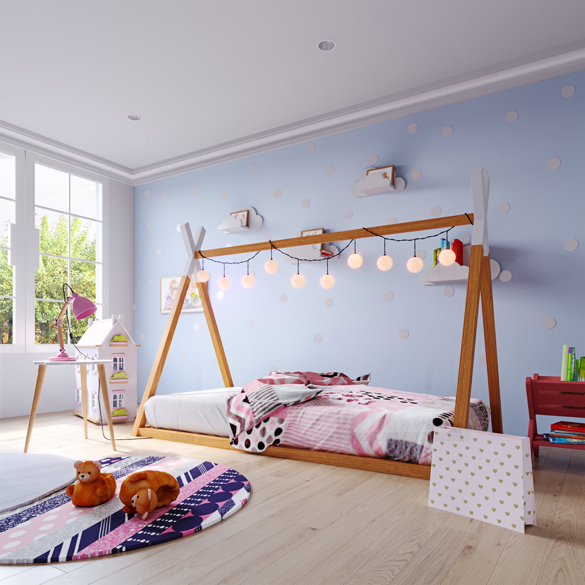 Helena Kids Single Solid Pine Teepee Bed Frame in Natural, featuring a teepee-style design with pink, white, and black bedding, adorned with glowing fairy lights, set against a playful, polka-dotted wall.