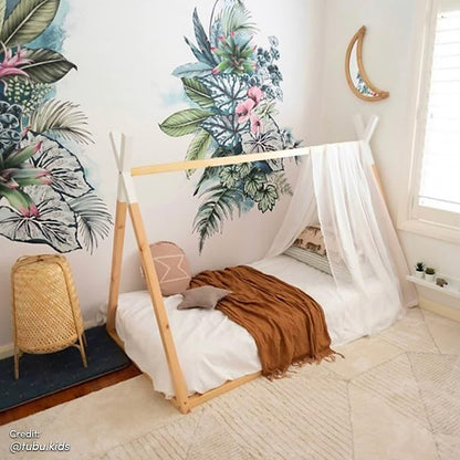Helena Kids Single Solid Pine Teepee Bed Frame in Natural, featuring a teepee design with a sheer canopy, set in a cozy children's room with a botanical mural and complementing decor.