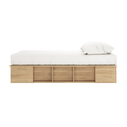 Herais Double Platform Bed Base with Storage in Oak, featuring a light-wood frame with built-in cubby storage and a white mattress, showcasing its practical and elegant design.