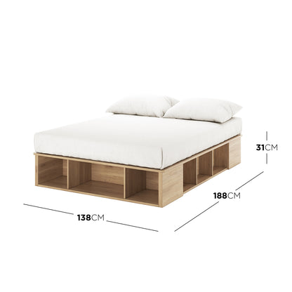 Herais Double Platform Bed Base with Storage in Oak showcases a light wood frame with cubby-style storage and a white mattress on top, offering a sleek, organized bedroom solution.