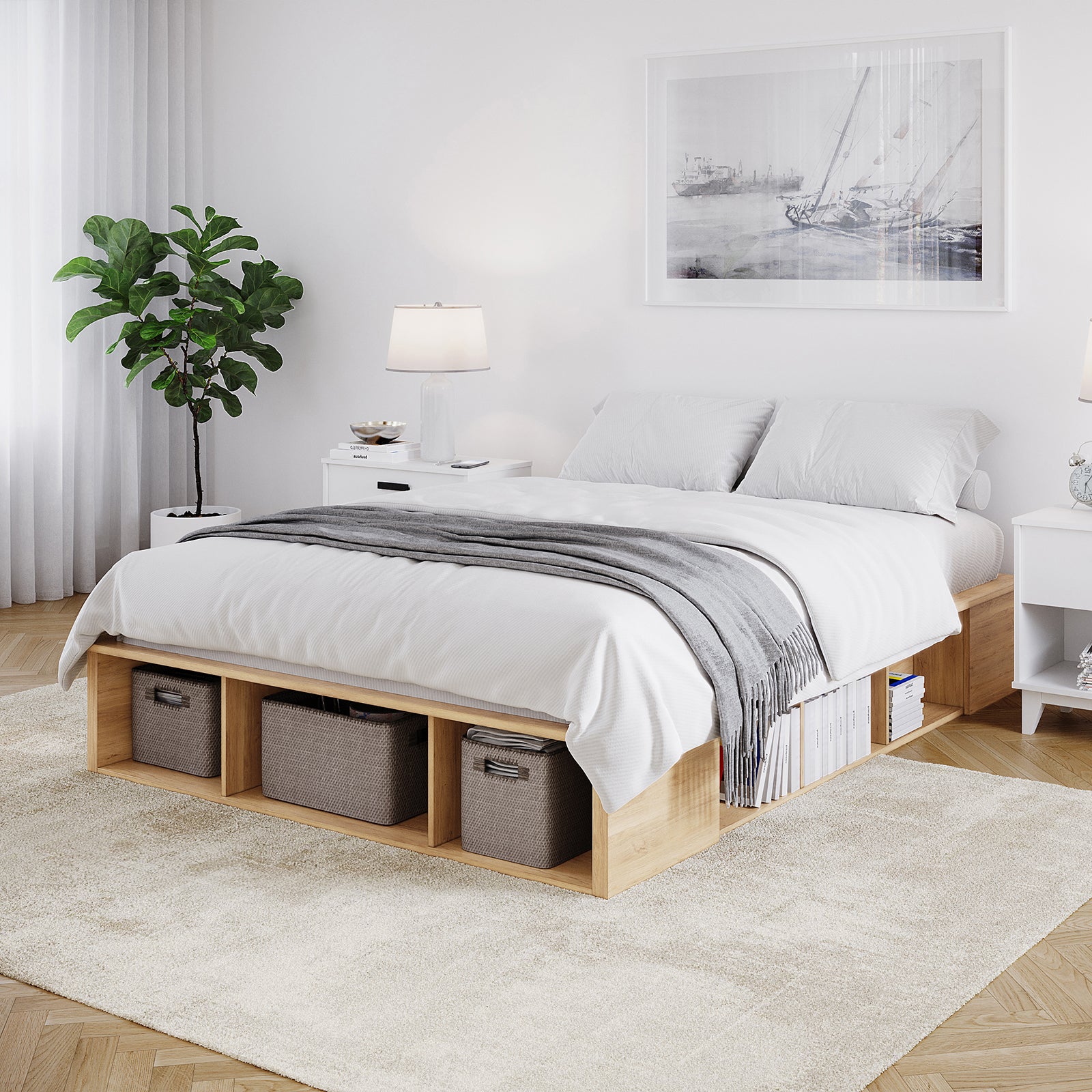 Herais Queen Platform Bed Base with Storage in Oak features a light-wood low platform, integrated storage cubbies holding baskets and books, and a clean, minimalist design with white bedding and a gray throw.