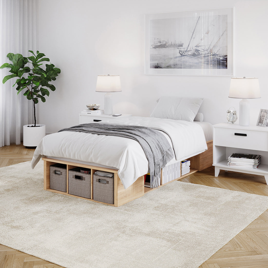 Herais Single Platform Bed Base with Storage in Oak features a low wooden frame, white linens, built-in shelving with fabric bins, and minimalist design, complemented by matching nightstands and a nautical-themed print.