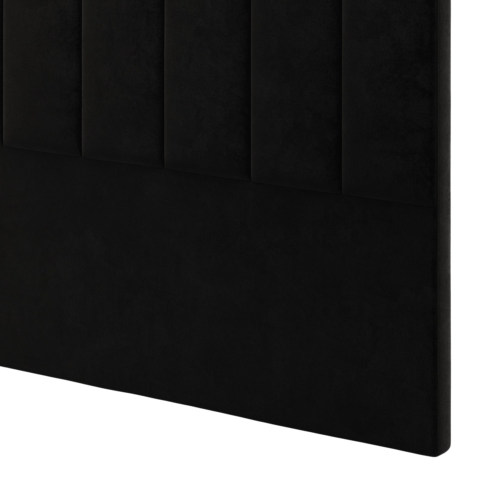 Gratiana Queen Velvet Fabric Headboard in Ink features a close-up of vertical channeling on its black upholstered surface, highlighting its sophisticated design with plush comfort and Art Deco elegance.