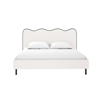 Kaylie Double Boucle Fabric Bed Frame in White & Black features a padded headboard with a wavy top, black-trimmed boucle upholstery, a low platform base on black legs, and includes two pillows.