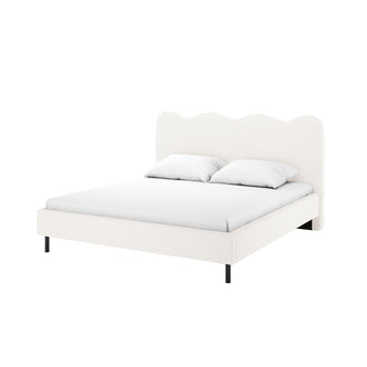 Kaylie Double Boucle Fabric Bed Frame in Cream White features a wavy headboard, upholstered in soft boucle, with slim dark legs, mattress, and pillows, offering modern elegance and comfort.