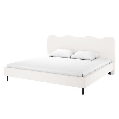 Kaylie King Boucle Fabric Bed Frame in Cream White features a scalloped upholstered headboard, matching rails, slim black metal legs, and a white mattress cover with two pillows, emphasizing minimalist luxury.