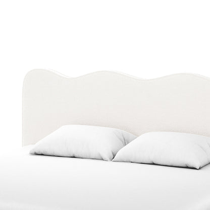 Kaylie King Boucle Fabric Bed Frame in Cream White features a scalloped upholstered headboard and white linens, highlighting its luxurious boucle texture and minimalist design.