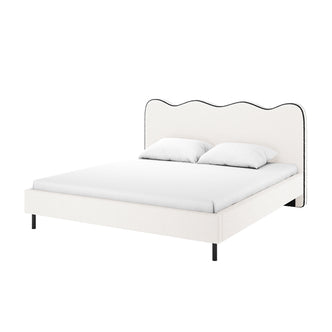 Kaylie Queen Boucle Bed Frame in White & Black: modern upholstered bed with a scalloped headboard, white fitted sheet, and pillows. Black metal legs add sleek support and elegance.